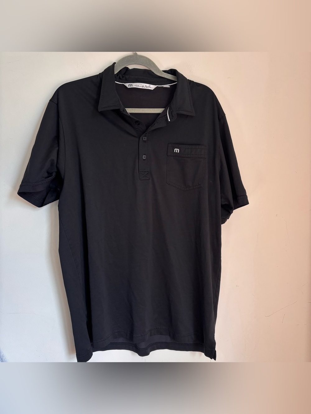 Travis Mathew black golf polo shirt